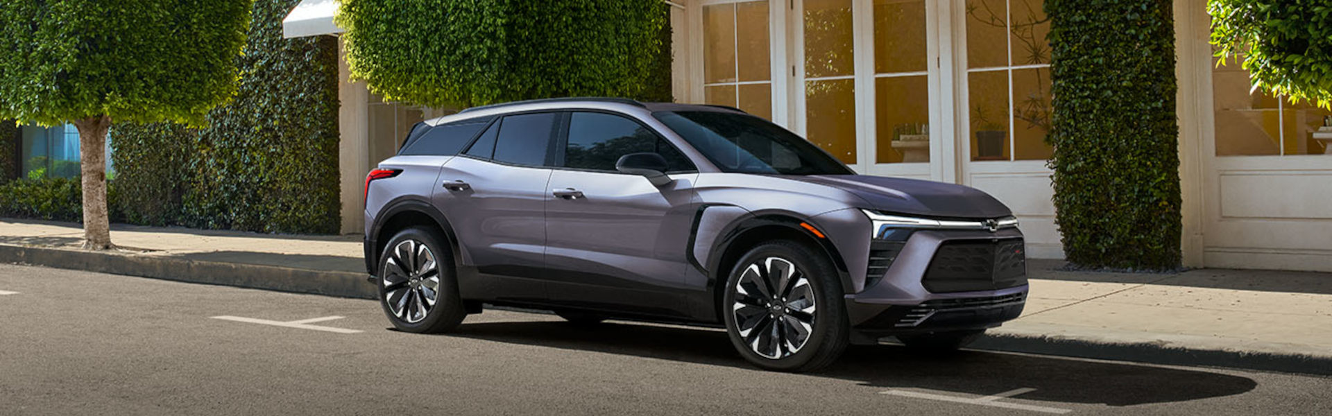 A 2025 Chevrolet Blazer parked on the roadside, showcasing its sleek design and modern features.