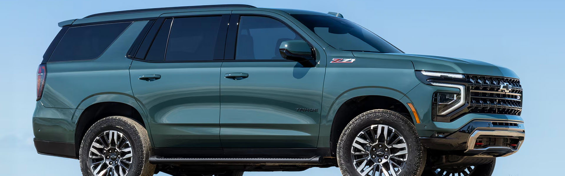 2026 Chevrolet Tahoe full-size SUV in green with Z71 trim and rugged off-road styling.