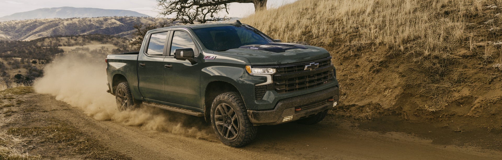 2026 Chevy Silverado 1500 driving down a country road